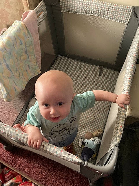 Elijah is registered to the contest to win money with this photo: armrest, auto_part, baby, baby_carriage, baby_products, baby_safety, baby_toddler_clothing, chair, child, comfort, couch, flooring, grass, infant_bed, person, product, room, sitting, smile, toddler