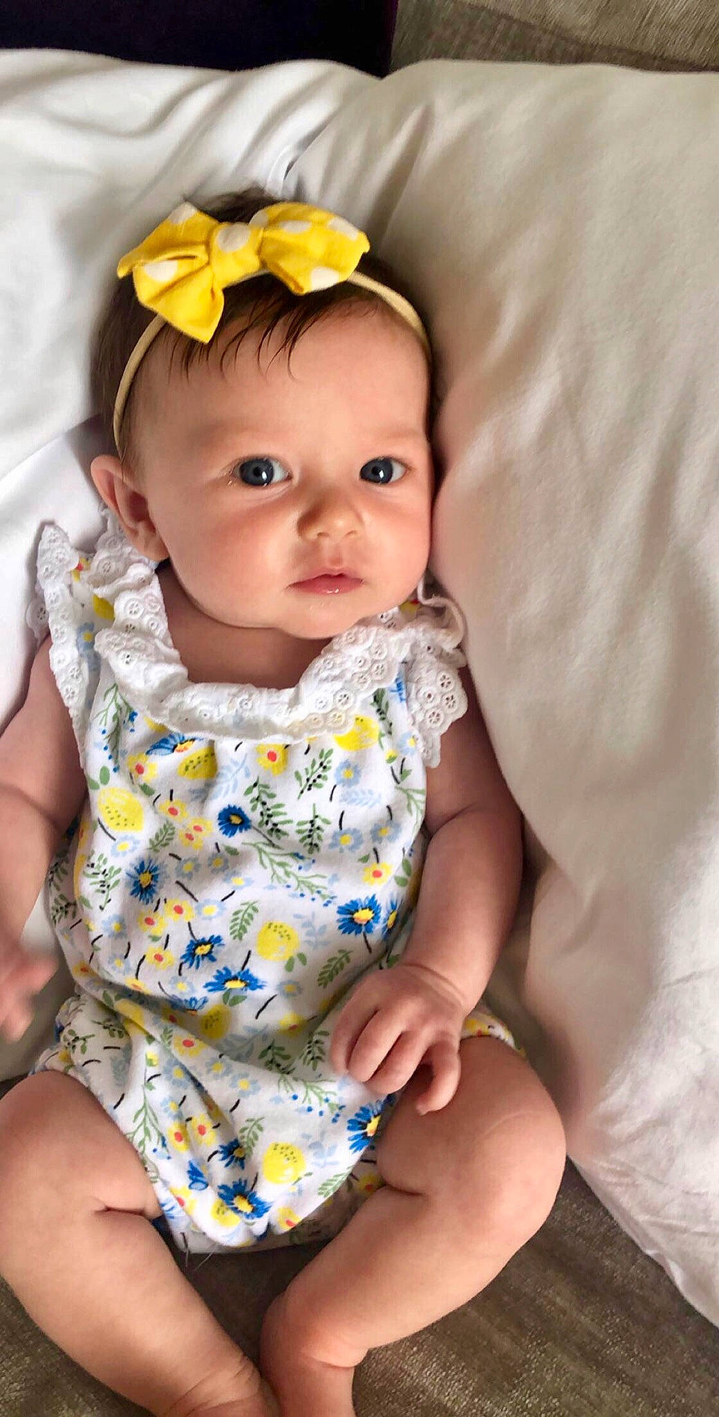 Kendall joined the competition — help win amazing prizes! baby, baby_products, baby_toddler_clothing, child, child_model, hair_accessory, headband, headgear, pattern, person, product, toddler, yellow