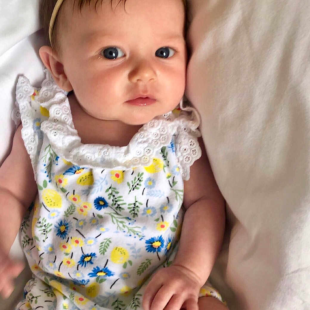 Kendall joined the competition — help win amazing prizes! baby, baby_products, baby_toddler_clothing, child, child_model, hair_accessory, headband, headgear, pattern, person, product, toddler, yellow