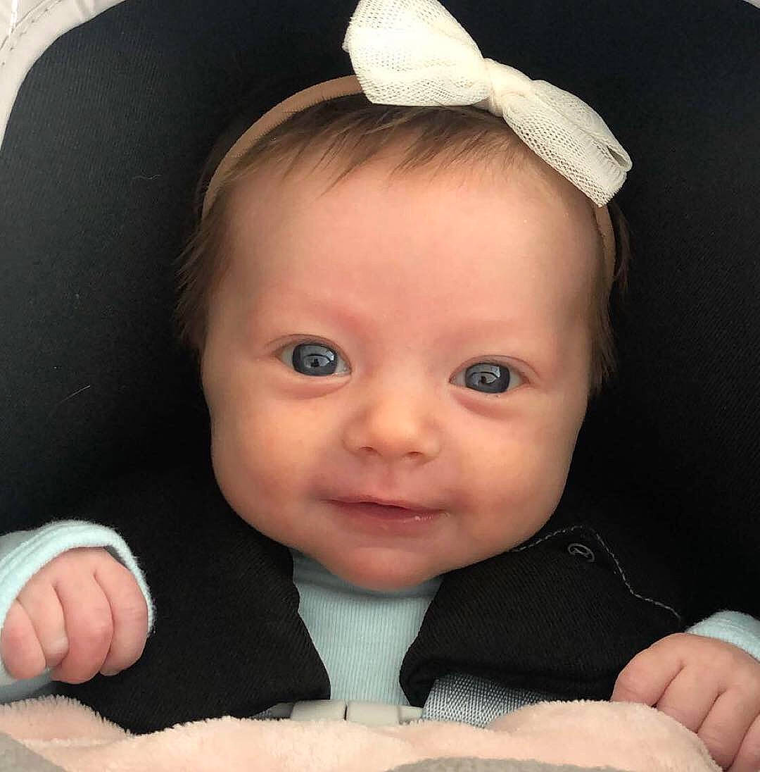 Kendall is registered to the contest to win money with this photo: baby, baby_making_funny_faces, cheek, child, chin, ear, eye, eyebrow, face, finger, forehead, hair_accessory, head, lip, mouth, nose, organ, person, product, skin