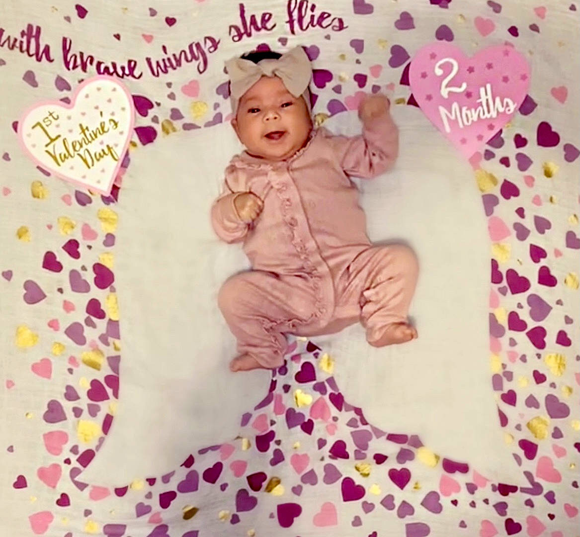 Addilyn is registered to the contest to win money with this photo: art, baby, baby_toddler_clothing, child, dress, fashion_accessory, font, happy, headwear, magenta, pattern, peach, person, petal, pink, purple, sleeve, supernatural_creature, textile, toddler