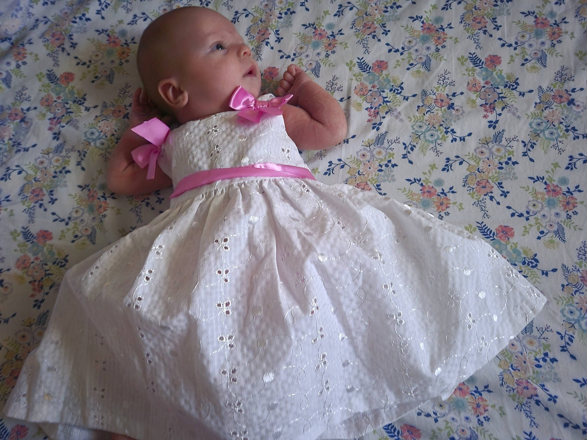 Rosalie joined the competition — help win amazing prizes! baby, baby_toddler_clothing, bridal_accessory, child, day_dress, dress, embellishment, face, gown, happy, linens, magenta, one_piece_garment, pattern, person, petal, pink, purple, skin, sleeve