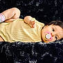 Meredith is registered to the contest to win money with this photo: animal, baby, biting, blanket, canine, clothing, dog, eating, face, food, happy, head, hosiery, person, pet, photography, portrait, smile, sock, yawning