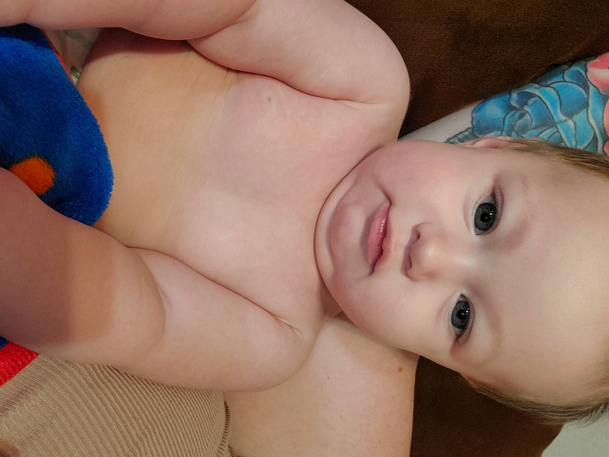 Brooklyn is registered to the contest to win money with this photo: arm, baby, blue, cheek, chest, comfort, eye, eyelash, finger, gesture, hand, head, joint, lip, mouth, muscle, neck, nose, person, skin