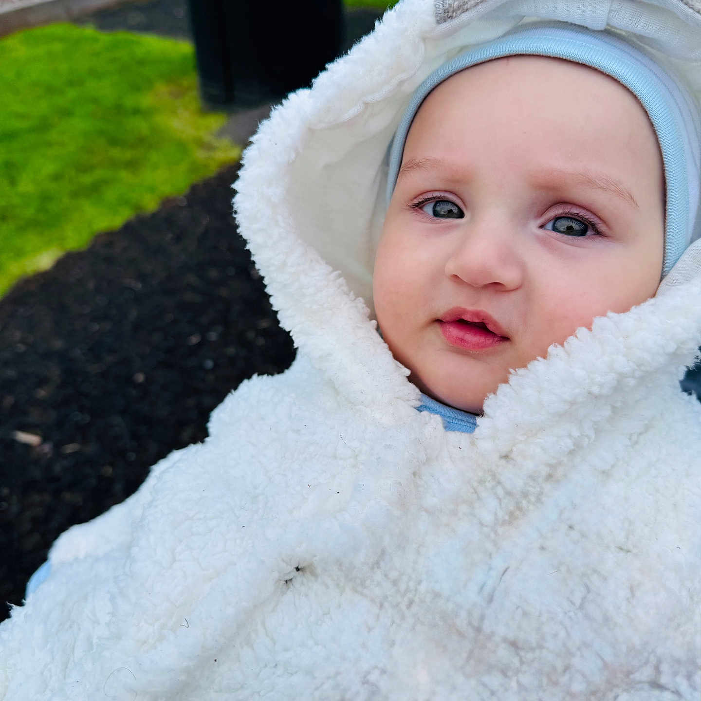 Mohammad Zain joined the competition — help win amazing prizes! baby, blanket, bonnet, cap, clothing, coat, face, grass, hat, head, hood, hoodie, jacket, knitwear, person, photography, plant, portrait, sweater, sweatshirt