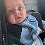animal_print, baby, baby_toy, blanket, blue_cloth, car_seat, child, close_up, clothing, cute, expression, eyes, face, indoor, infancy, infant, person, portrait, seatbelt, young_child