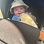 baby, baby_face, baby_toy, bucket_hat, child, clothing, cute, happy, hat, headwear, infant, outdoor, person, plush_toy, portrait, seat, smiling, stroller, sunlight, young_child