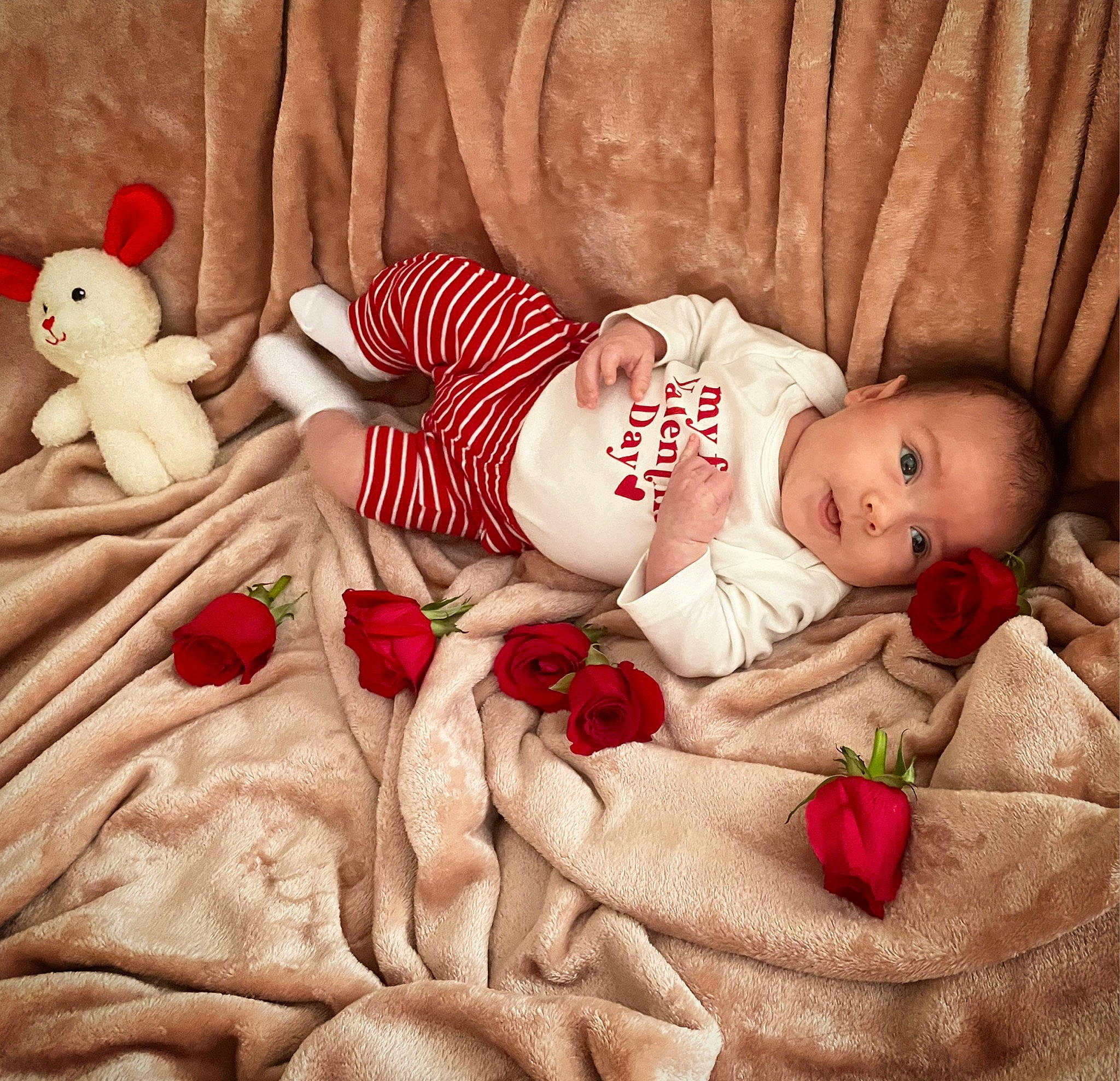 Dawson is registered to the contest to win money with this photo: baby, baby_sleeping, baby_toddler_clothing, beauty, child, christmas, comfort, design, event, happy, human_body, linens, mammal, person, pink, product, red, room, textile, toy
