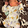 newborn, baby, sleeping, onesie, winnie_the_pooh, pacifier, blanket, cow_pattern, soft, cozy, infant, cute, clothing, resting, child, portrait, indoors, peaceful, small, person