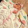 Brianna joined the competition — help win amazing prizes! baby, infant, blanket, floral_pattern, pink, white, mittens, headband, sleepwear, soft_texture, lying_down, cute, newborn, cozy, child, portrait, indoors, resting, fabric, comfort
