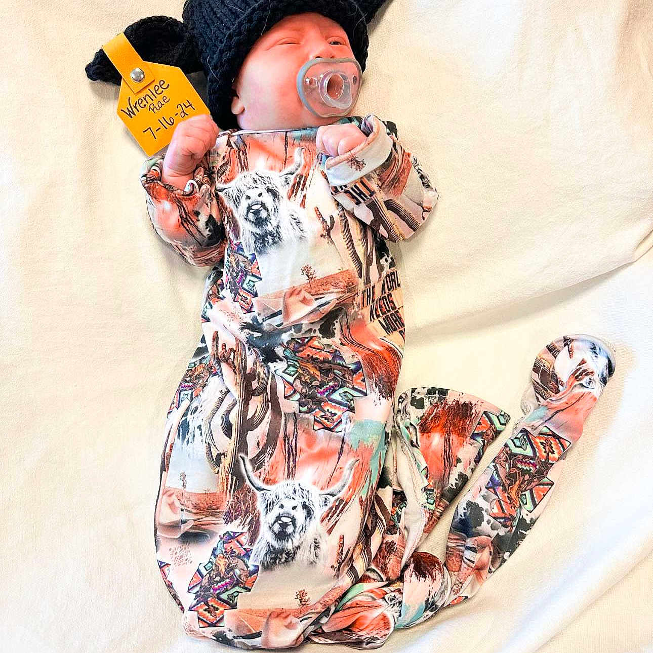 Wrenlee joined the competition — help win amazing prizes! baby, beachwear, blanket, cap, clothing, face, happy, hat, head, pajamas, pants, person, photography, portrait, skin, sleeve, smile, tattoo, text, yawning