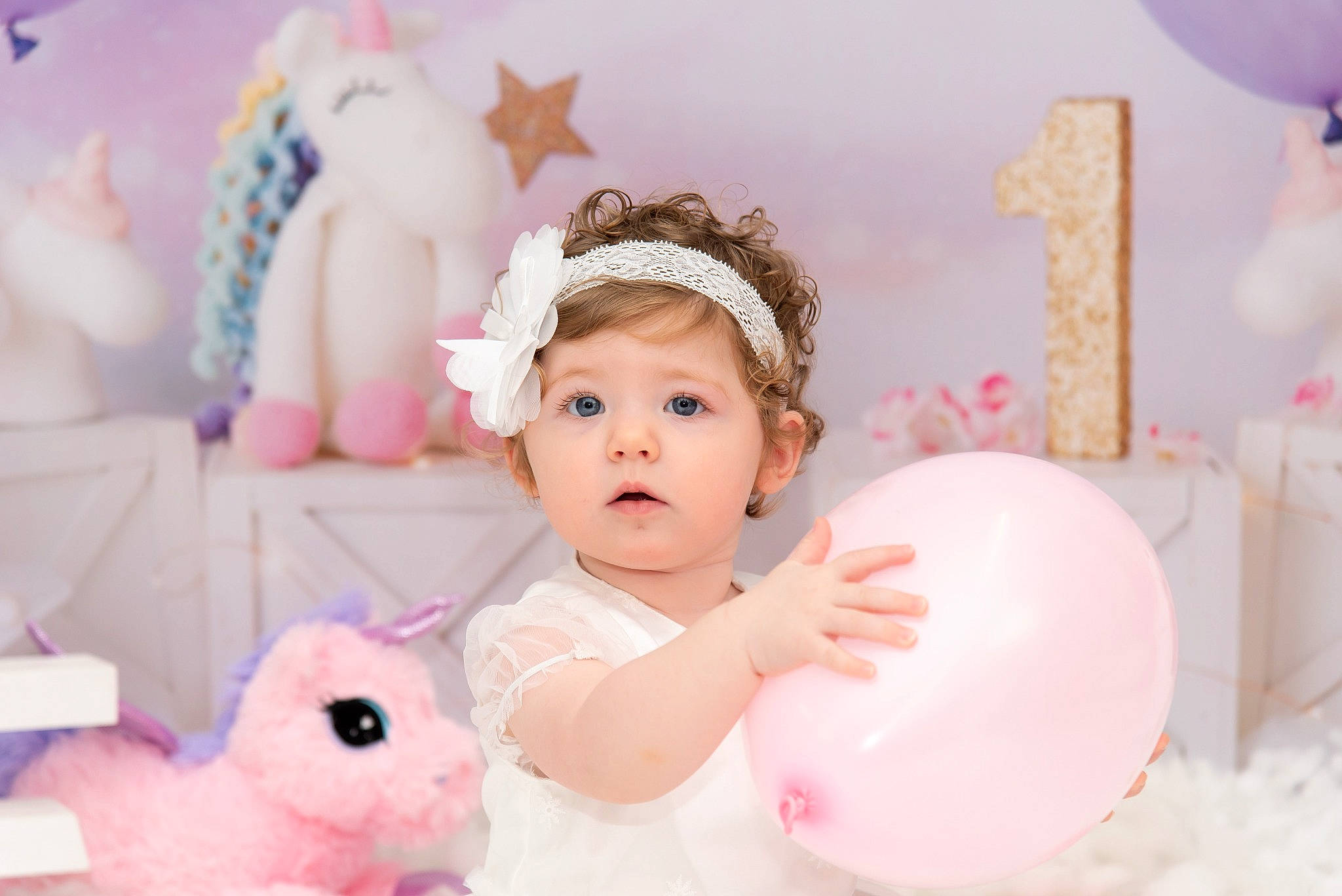 Isla-grace is registered to the contest to win money with this photo: baby, baby_toddler_clothing, balloon, birthday_party, child, event, facial_expression, fun, happy, headpiece, lighting, party_supply, people, person, pink, product, skin, surprise, sweetness, textile