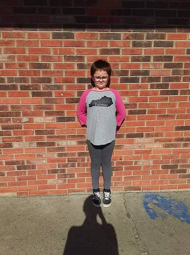 Nancy Sue is registered to the contest to win money with this photo: asphalt, brick, brickwork, child, electric_blue, fun, happy, leisure, magenta, outerwear, pattern, person, recreation, sleeve, smile, standing, street_fashion, symmetry, tints_and_shades, toddler