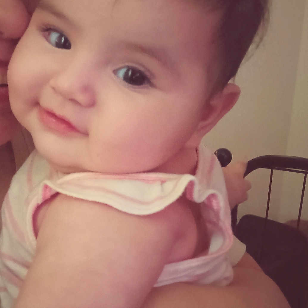 Cassandra joined the competition — help win amazing prizes! apparel, arm, baby, chair, child, closeup, cute, face, furniture, hair, holding, human, indoor, infant, parent, person, skin, smile, soft_light, toddler
