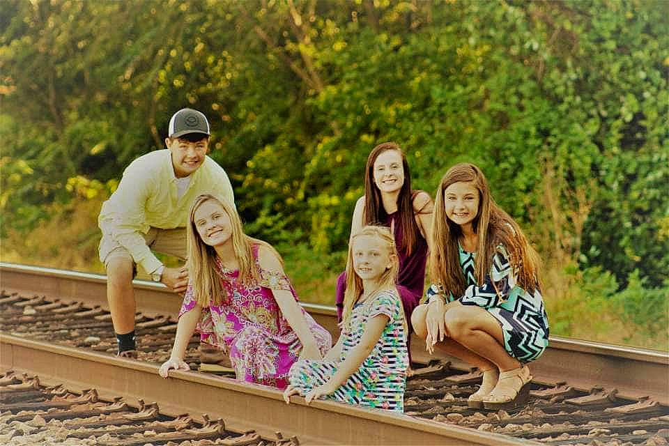 Kinleigh is registered to the contest to win money with this photo: family, fun, headwear, joy, leisure, nonbuilding_structure, people, person, photo_shoot, photography, railway, sitting, tourism, track