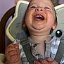 baby, laughing, high_chair, messy_face, food, child, happy, smile, infant, cute, clothing, straps, indoor, closeup, chubby_cheeks, mouth_open, hand, skin, person, seat