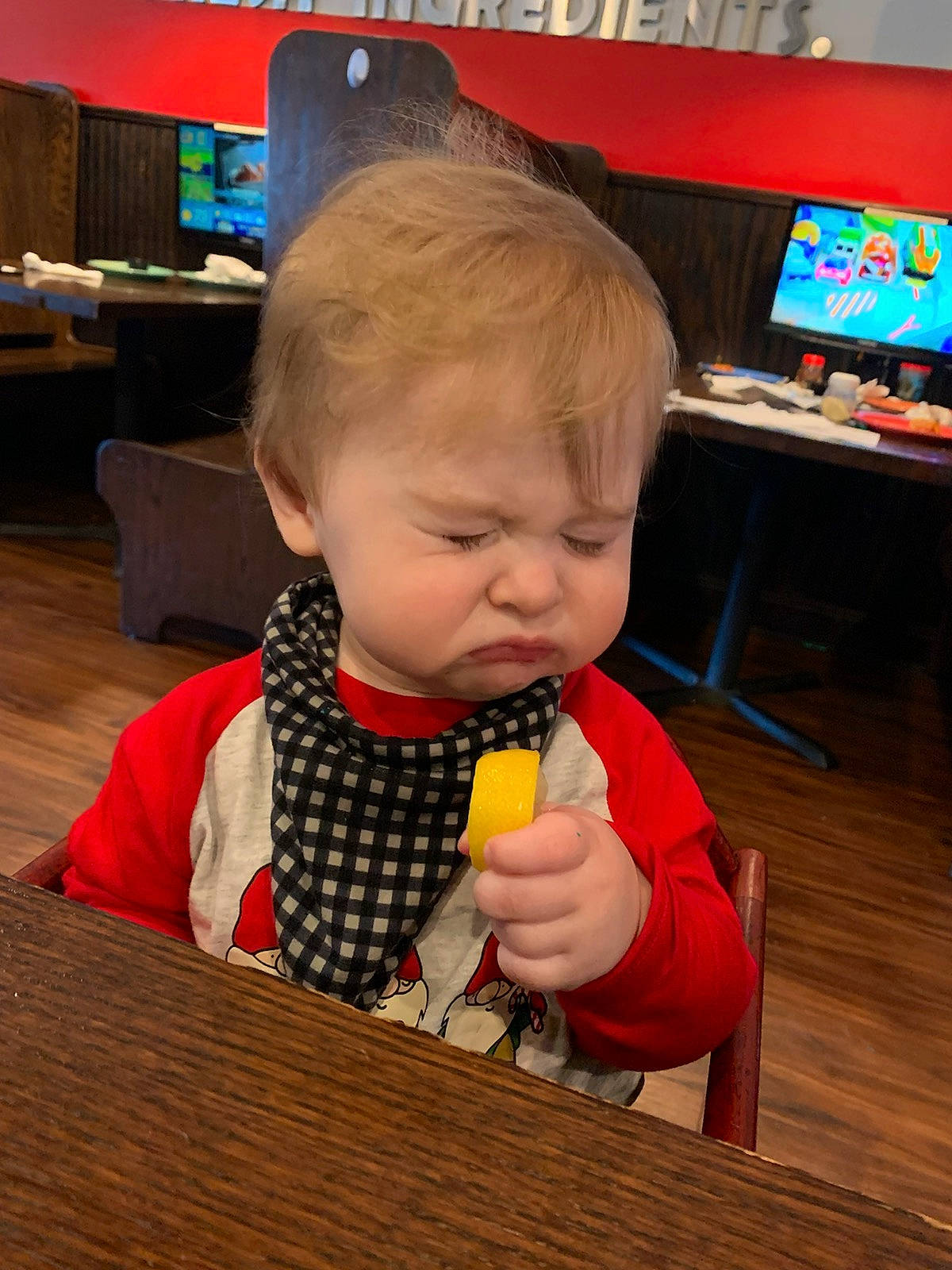 Kolton is registered to the contest to win money with this photo: baby, baby_toys, biting, chair, child, display_device, flooring, fun, hardwood, led_backlit_lcd_display, person, play, room, sorrow, table, television, toddler, toy, varnish, wood