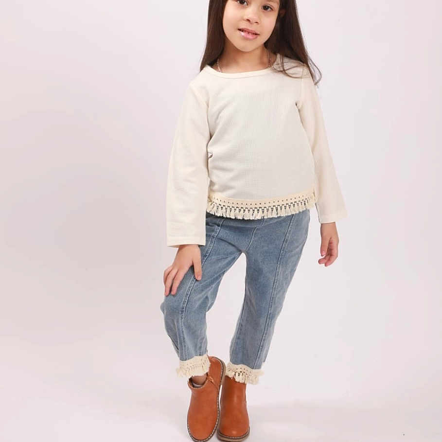 Jasmine joined the competition — help win amazing prizes! boots, casual_clothing, child, confident, cute, denim_pants, fashion, footwear, full_body, girl, long_hair, portrait, pose, smile, standing, studio_photo, sweater, tassels, white_background, young