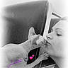 black_and_white, cat, sphynx_cat, woman, face, kiss, affection, close_up, indoor, chair, pet, love, animal, feline, human, head, skin, cute, text_overlay, vignette