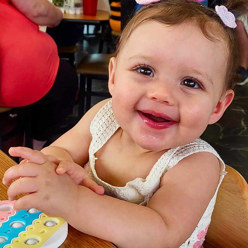 Paisley is registered to the contest to win money with this photo: baby, babylaughing, child, clothing, cream, cup, dessert, face, female, food, footwear, girl, happy, head, icing, person, photography, portrait, shoe, smile