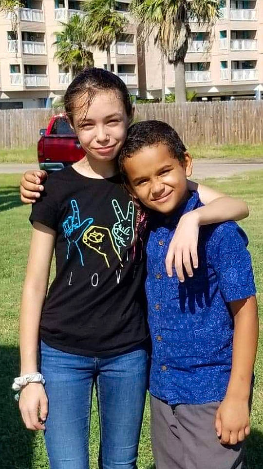 Malik joined the competition — help win amazing prizes! child, cool, facial_expression, family, friendship, fun, grass, happy, hug, interaction, jeans, joy, leisure, people, person, shoulder, sibling, smile, t_shirt, toddler