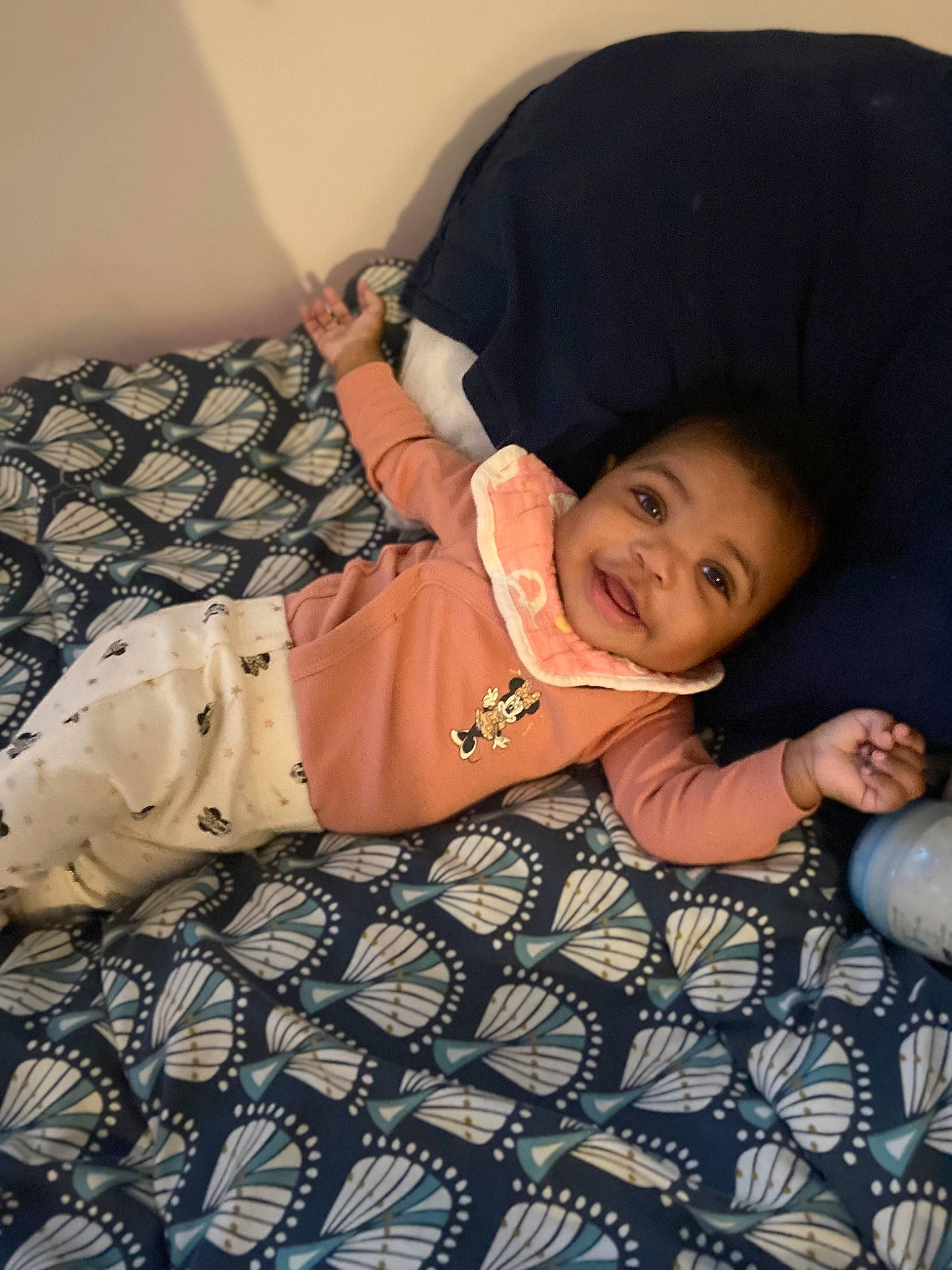 Anaya participe au concours pour gagner de l'argent avec cette photo : baby, baby_toddler_clothing, child, comfort, elbow, flash_photography, flooring, fun, happy, human_leg, linens, pattern, person, room, sitting, skin, sleeve, smile, t_shirt, toddler