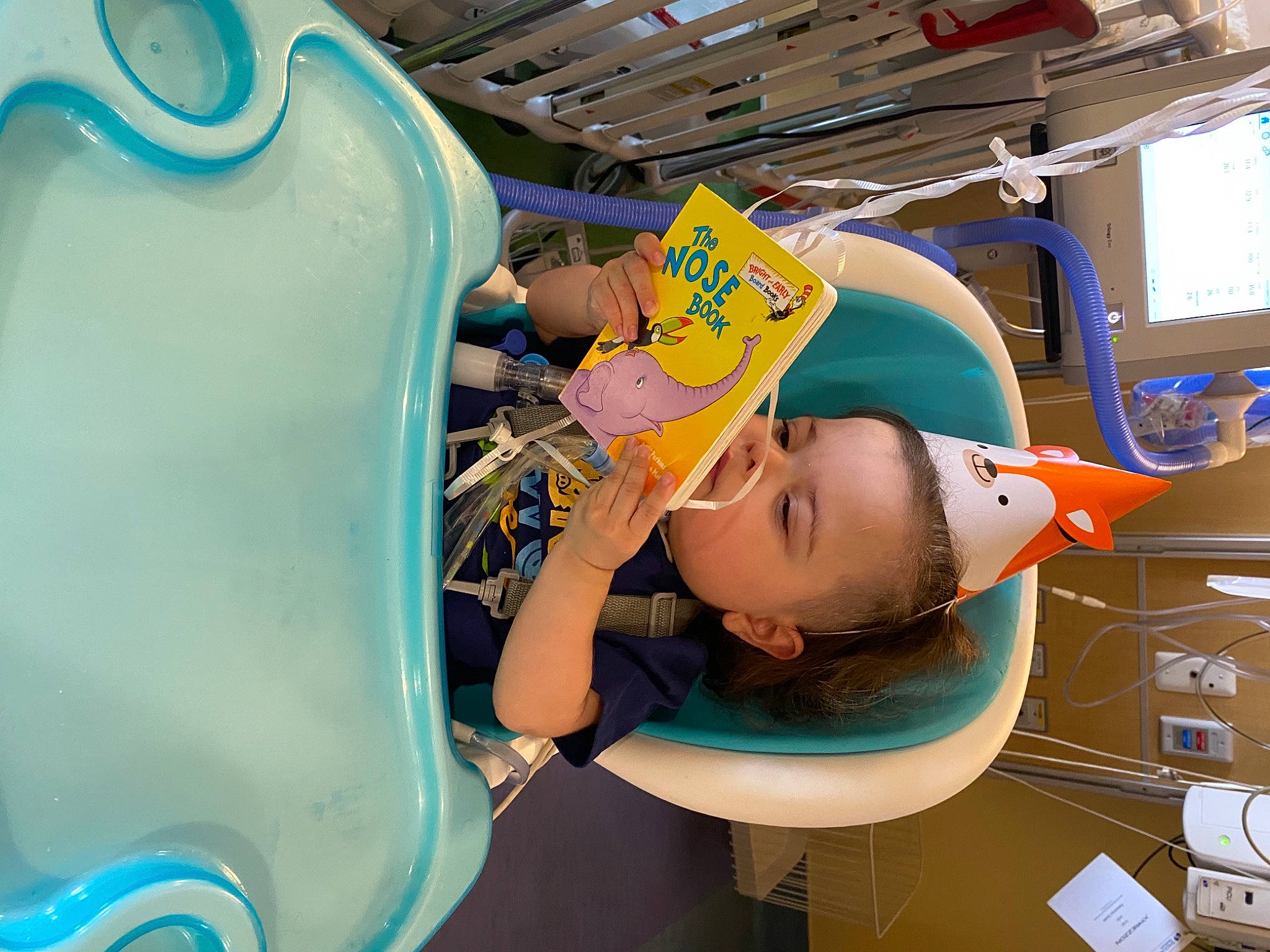 Jack is registered to the contest to win money with this photo: animation, baby, baby_toddler_clothing, baseball_cap, blue, cap, child, fun, hat, helmet, leisure, machine, person, personal_protective_equipment, plastic, play, recreation, room, t_shirt, toddler