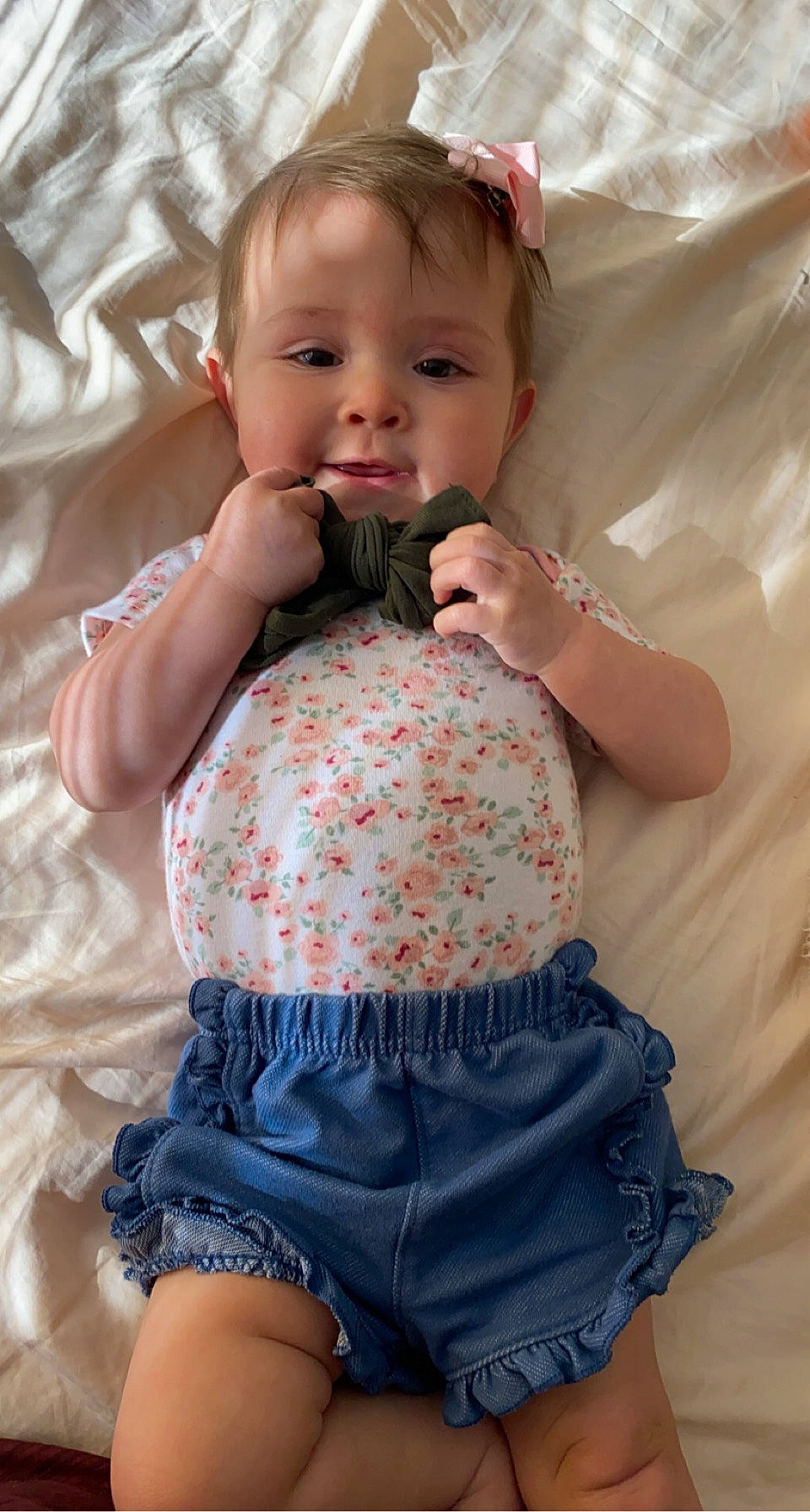 Aubriella is registered to the contest to win money with this photo: arm, baby, baby_toddler_clothing, cheek, dress, eye, hair, hairstyle, hand, head, human_body, iris, joint, lip, neck, person, pink, skin, sleeve, textile