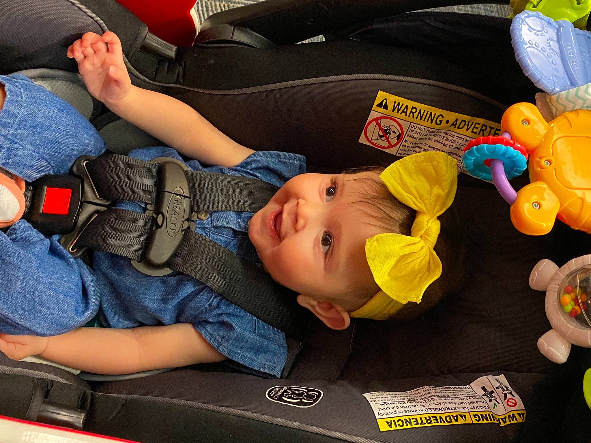 Aubriella is registered to the contest to win money with this photo: auto_part, baby, baby_products, baby_toddler_clothing, baby_toys, baseball_cap, car_seat, child, comfort, fun, orange, people, person, product, sitting, toddler, toy, travel