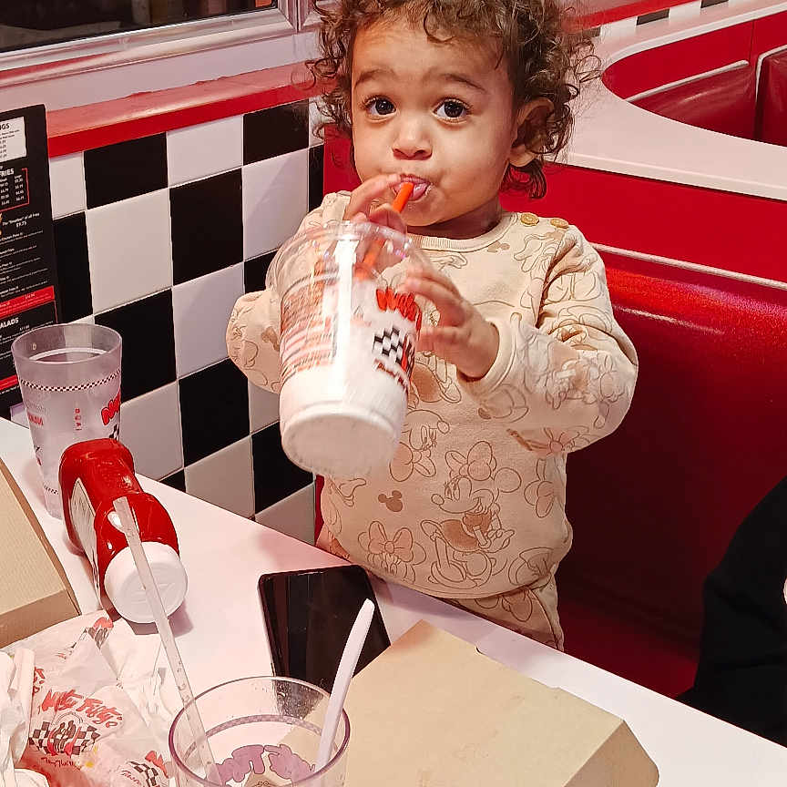 Brinleigh joined the competition — help win amazing prizes! adult, baby, cup, cutlery, diner, disposablecup, electronics, face, food, head, indoors, male, man, mobilephone, pen, person, photography, portrait, restaurant, spoon