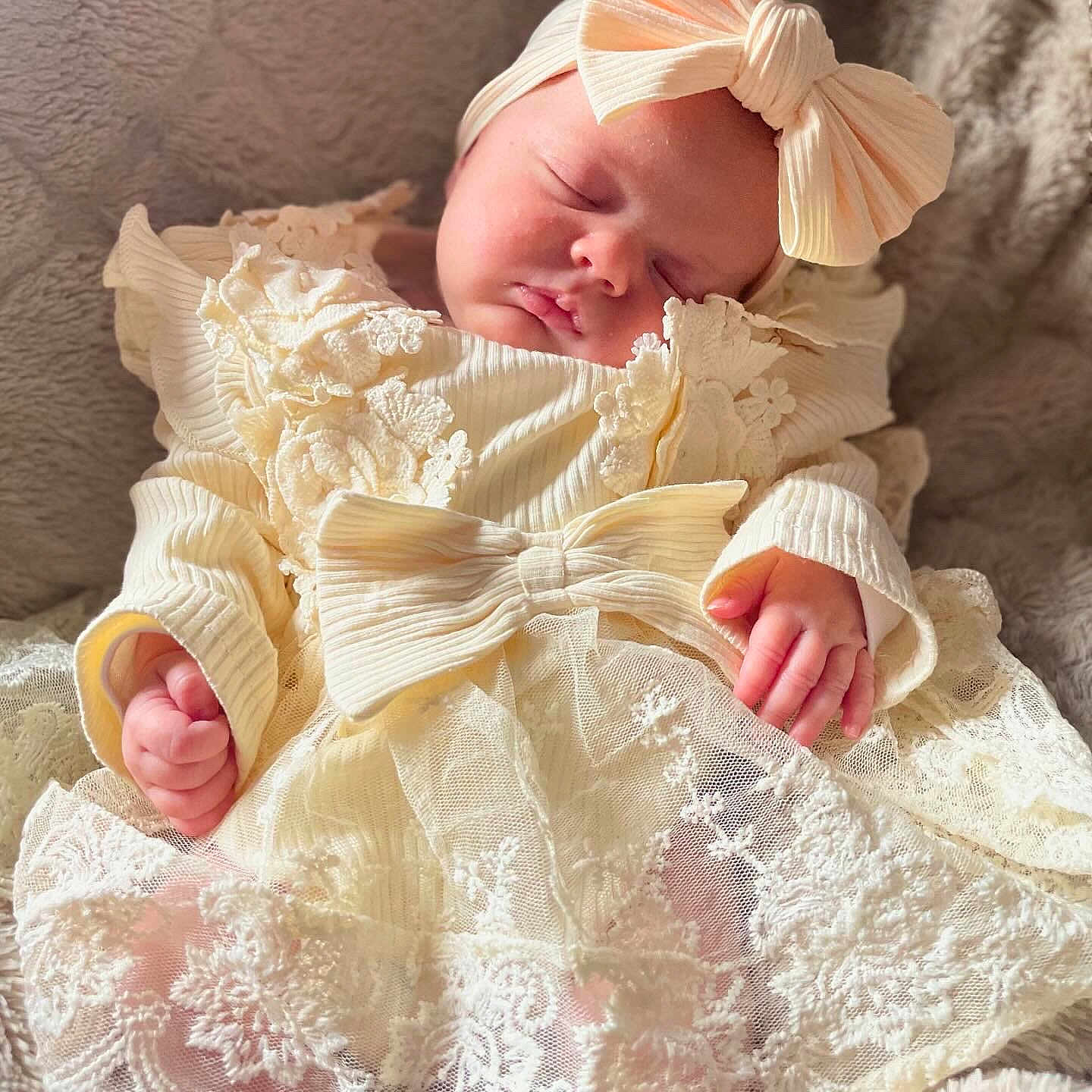 Oakleigh-May is registered to the contest to win money with this photo: adorable, baby, bow, child, closeup, clothing, cozy, cute, delicate, hands, headband, infant, lace_dress, newborn, peaceful, portrait, sleeping, soft_blanket, texture, warm