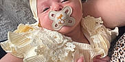 Oakleigh-May joined the competition — help win amazing prizes! baby, infant, pacifier, headband, bow, lace, clothing, person, arm, blanket, texture, soft, cute, sleepy, indoors, fabric, closeup, newborn, resting, comfort