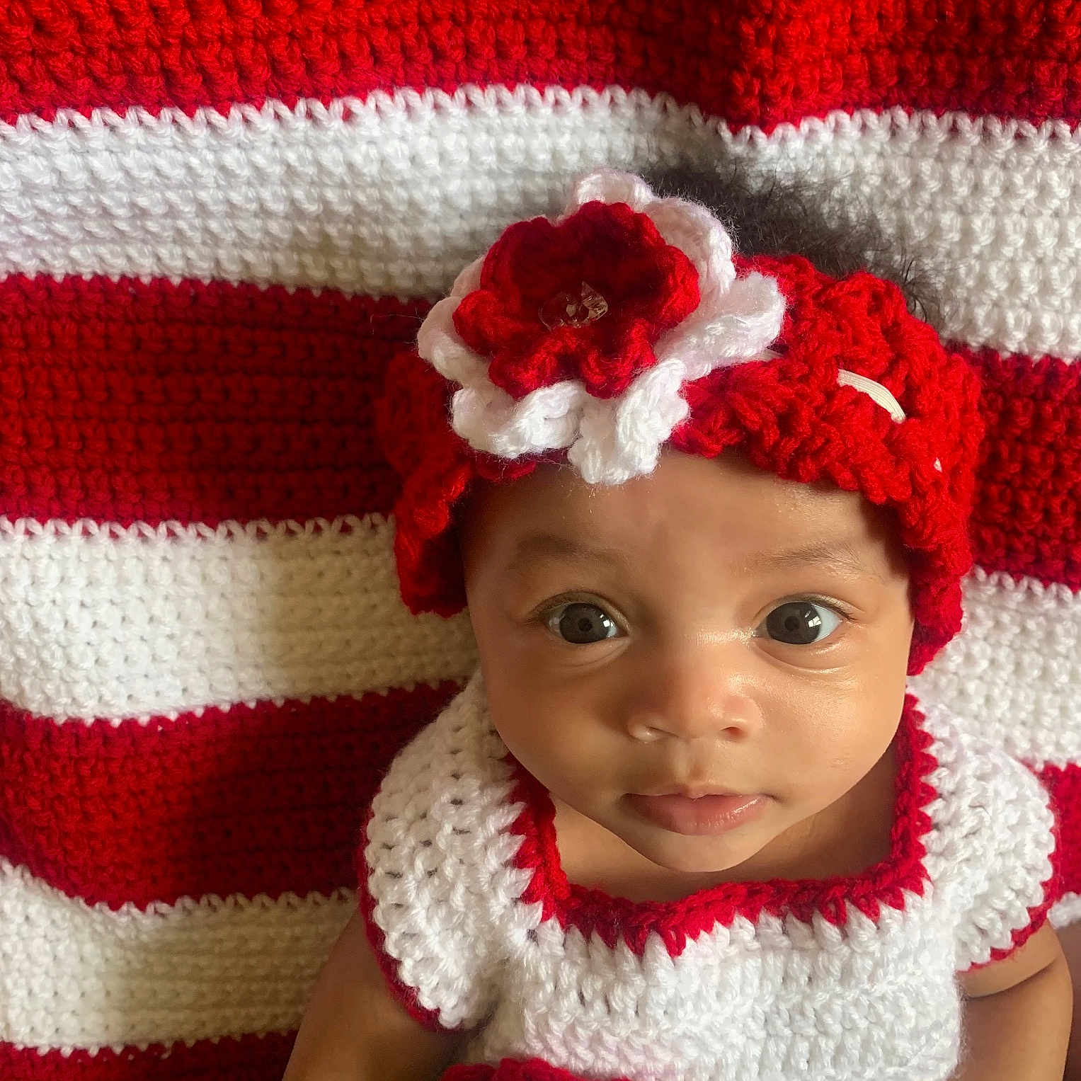 Aleenah is registered to the contest to win money with this photo: accessories, baby, beanie, blanket, bonnet, cap, clothing, couch, cushion, face, hat, head, homedecor, hood, knitwear, newborn, person, photography, portrait, sweater