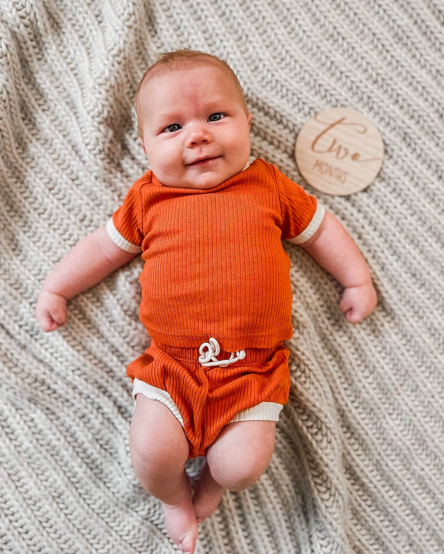 Cole joined the competition — help win amazing prizes! art, baby, baby_toddler_clothing, eye, finger, happy, human_leg, joy, nail, orange, pattern, peach, person, product, skin, sleeve, smile, textile, thigh, thumb