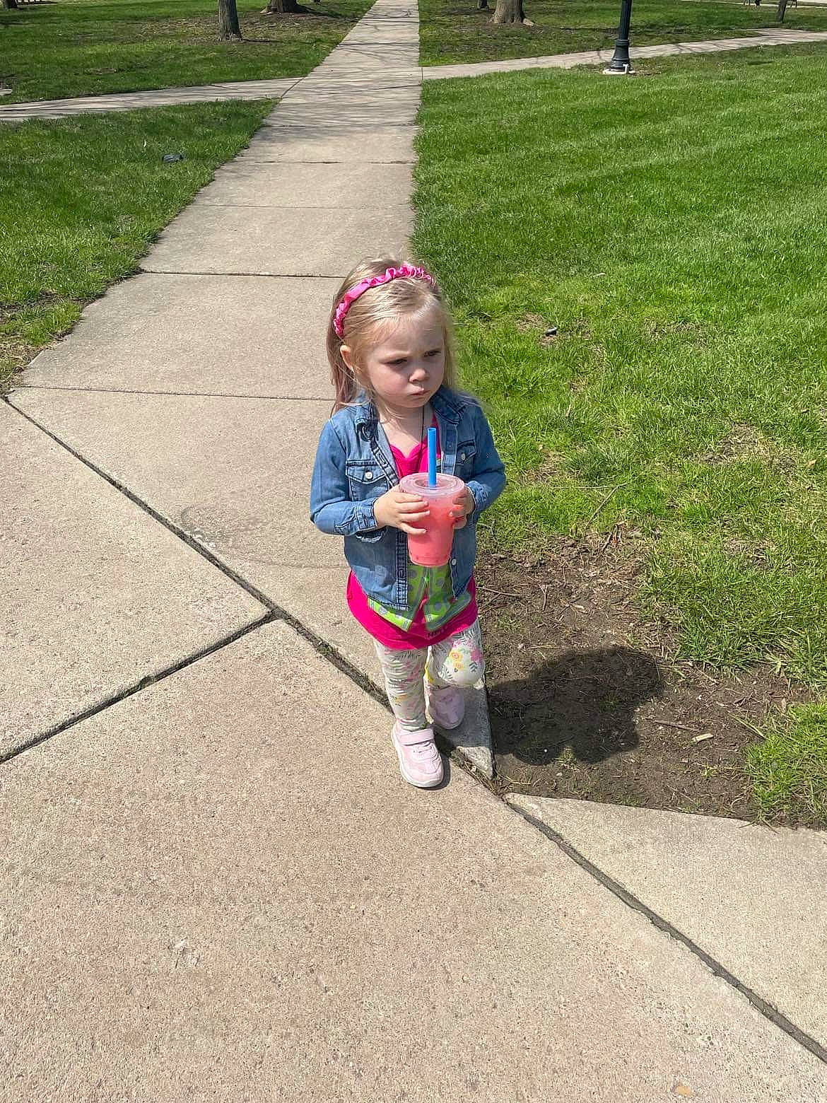 Skarlett is registered to the contest to win money with this photo: asphalt, child, city, driveway, fun, grass, lawn, leisure, pedestrian, person, plant, play, recreation, road, road_surface, sidewalk, soil, toddler, tree, walking