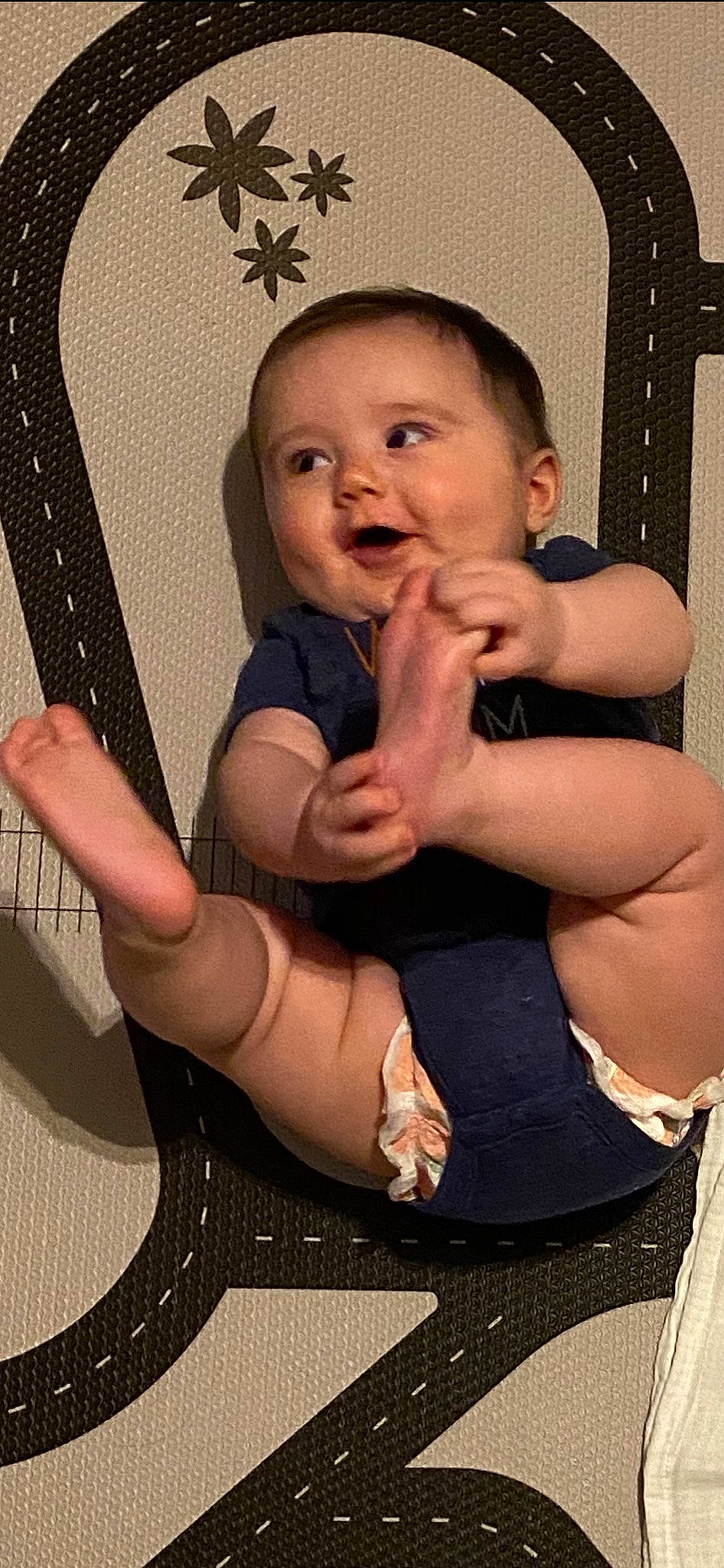 Cash is registered to the contest to win money with this photo: arm, baby, cheek, child, facial_expression, finger, gesture, leg, muscle, person, thigh, thumb, toddler