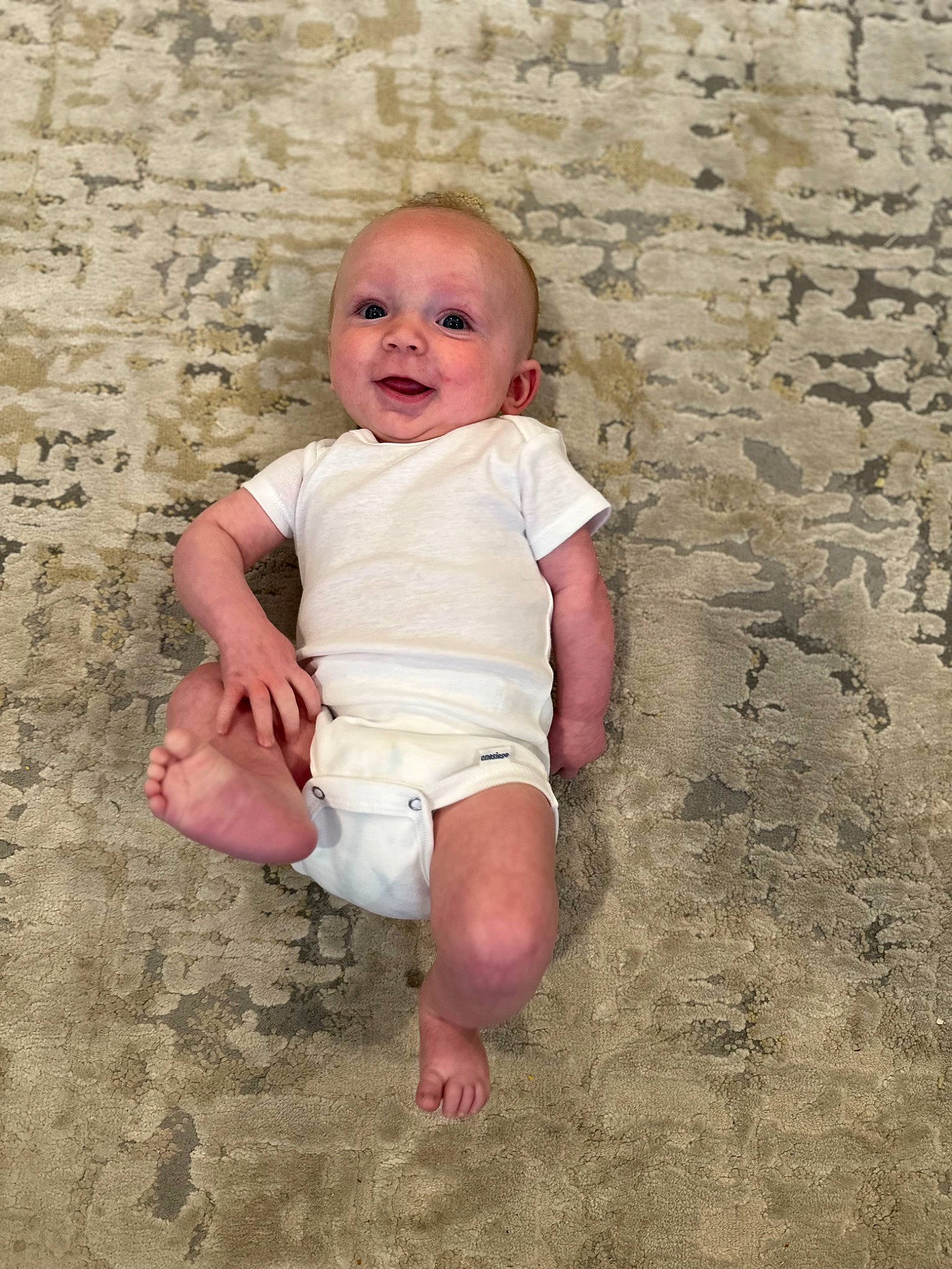 Chase is registered to the contest to win money with this photo: art, baby, baby_toddler_clothing, child, chin, concrete, flash_photography, flooring, foot, fun, happy, human_leg, landscape, people_in_nature, person, sand, sitting, smile, soil, toddler