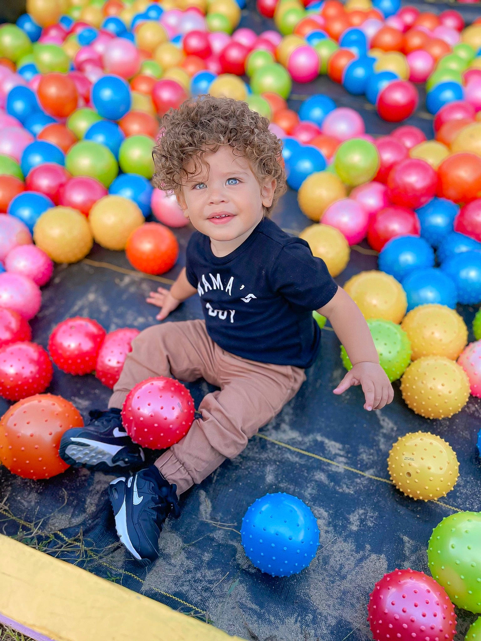 Cameron joined the competition — help win amazing prizes! ball, ball_pit, beauty, black, child, community, facial_expression, fun, happy, leisure, person, photograph, playing_sports, public_space, recreation, shirt, smile, t_shirt, toddler, white