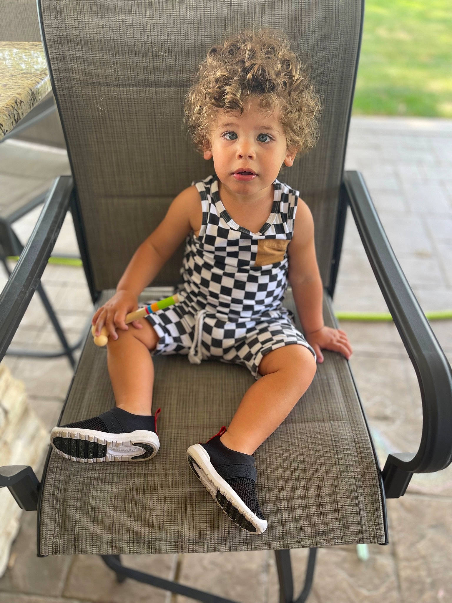 Cameron joined the competition — help win amazing prizes! baby_toddler_clothing, blond, chair, child, dress, fun, grass, hairstyle, human_leg, leisure, outdoor_furniture, pattern, person, product, recreation, sandal, shoe, sitting, sock, thigh