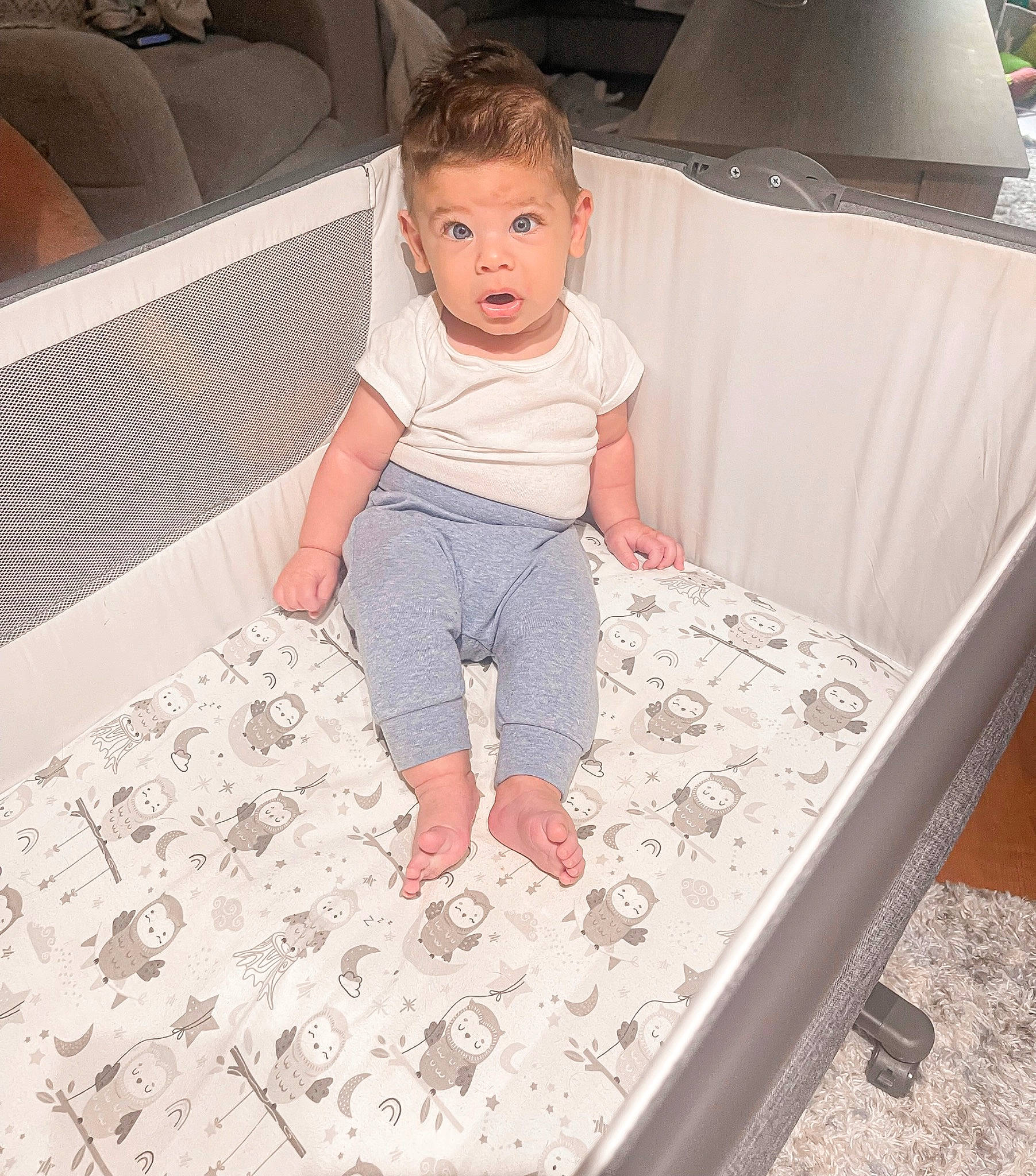 Cameron is registered to the contest to win money with this photo: baby, baby_products, baby_safety, baby_toddler_clothing, chair, child, comfort, couch, flooring, foot, fun, leisure, linens, pattern, person, product, room, sitting, sleeve, surprise