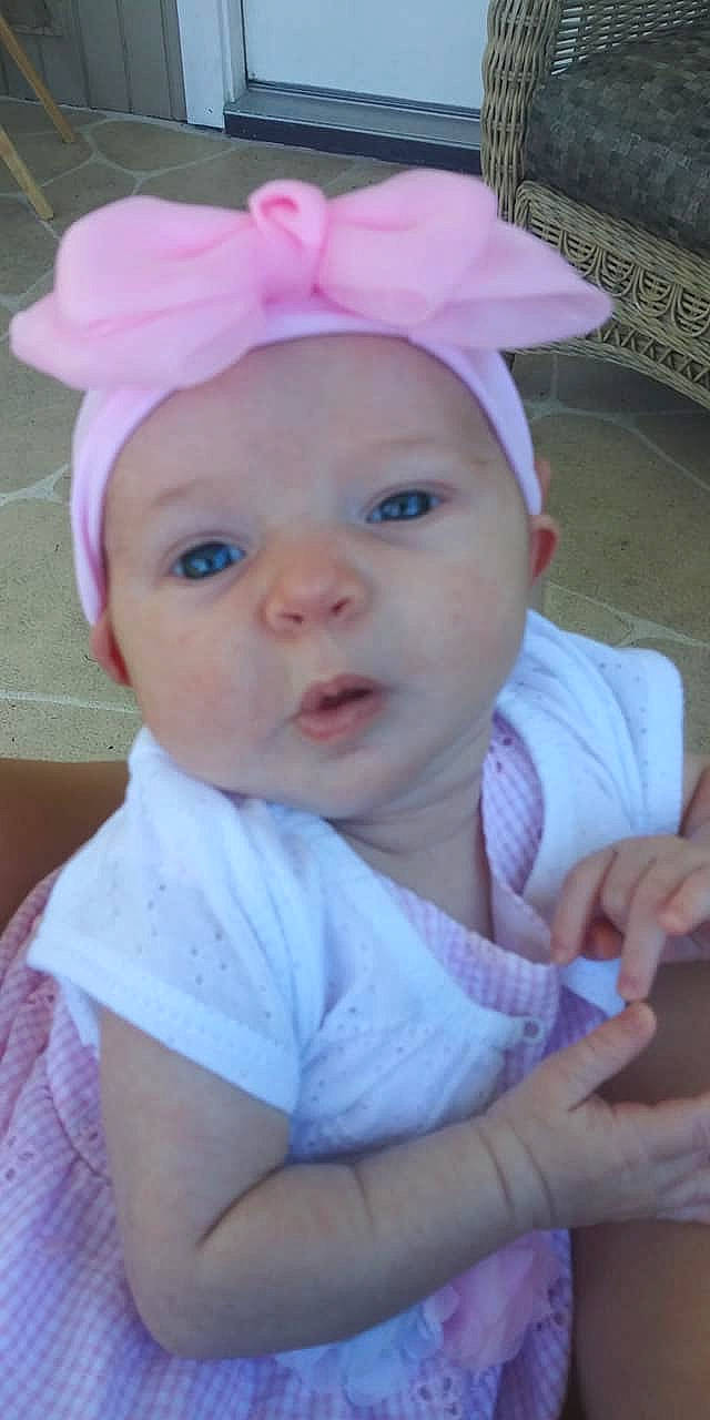 Anastasia is registered to the contest to win money with this photo: baby, cheek, child, ear, eye, face, fashion_accessory, hair_accessory, head, headgear, lip, person, pink, skin, smile, toddler