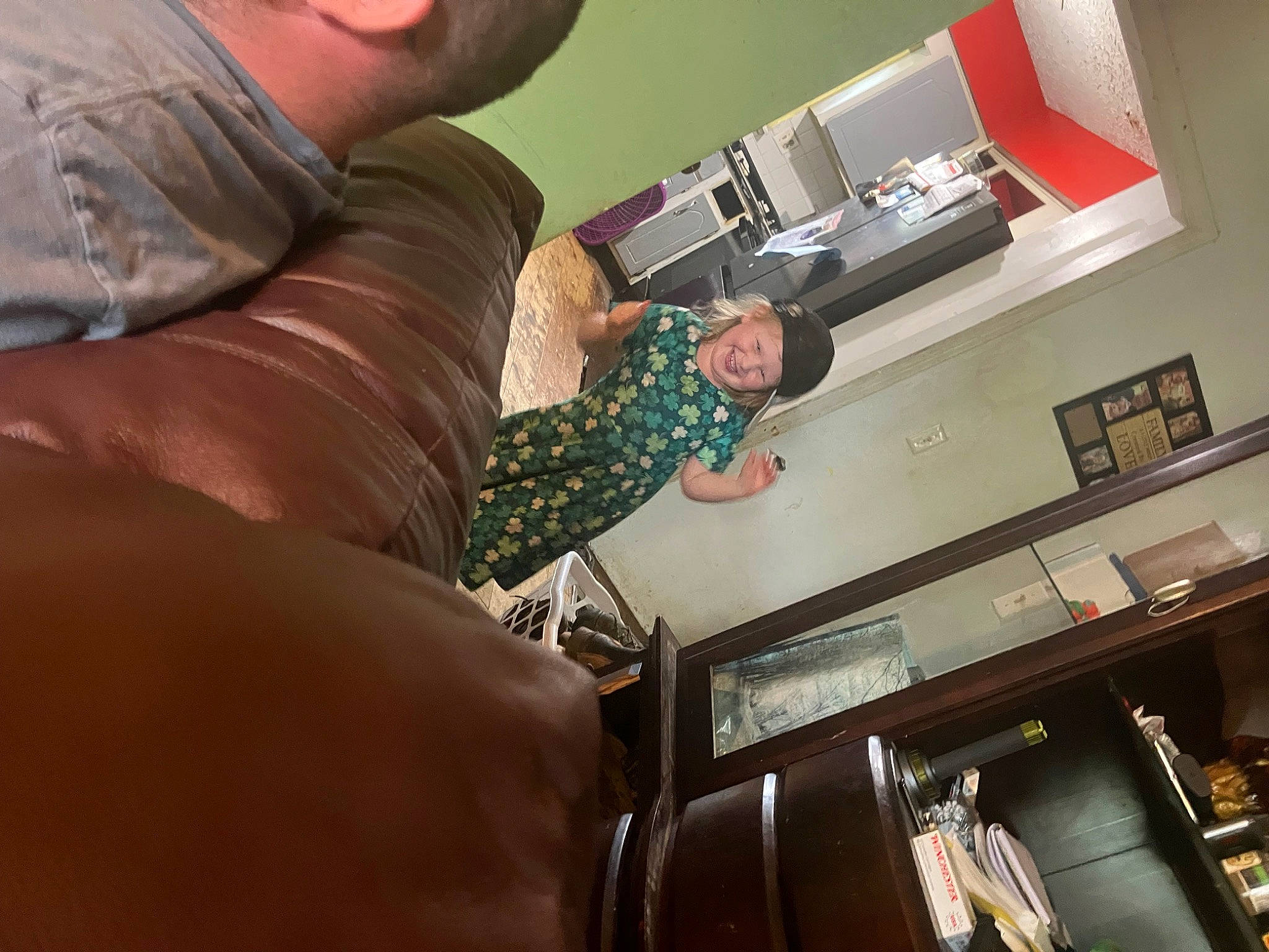 Josie is registered to the contest to win money with this photo: comfort, elbow, electronic_device, fun, headwear, human_leg, joy, machine, person, room, service, thigh, wrist