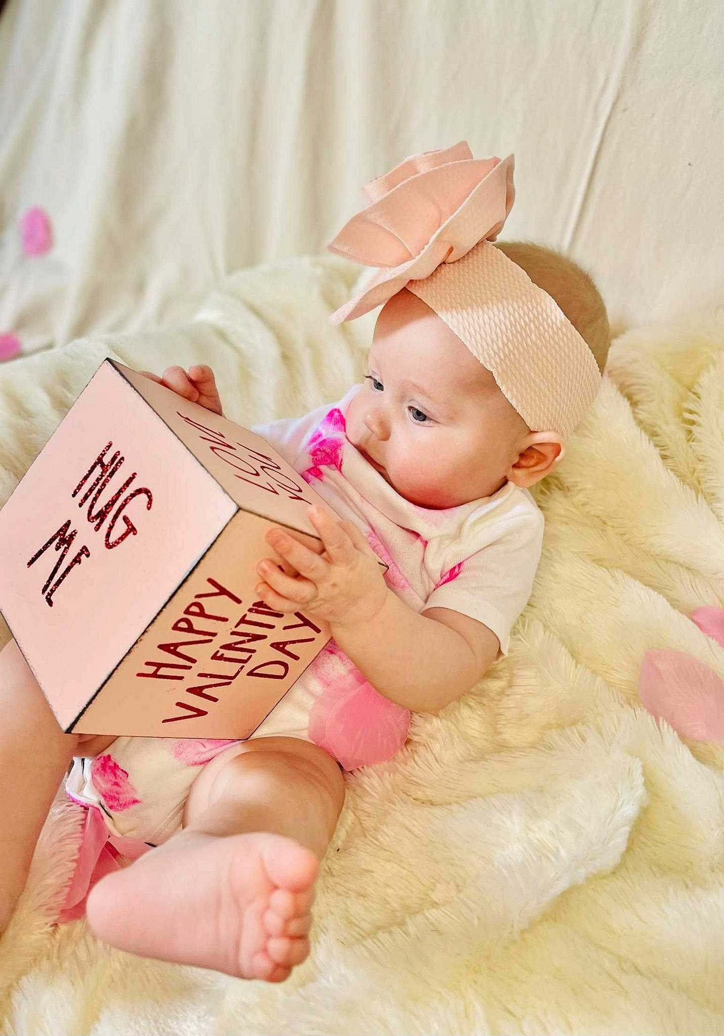 Astrid is registered to the contest to win money with this photo: baby, baby_sleeping, baby_toddler_clothing, cap, child, comfort, finger, foot, happy, human_leg, linens, magenta, nail, peach, person, pink, sitting, skin, thigh, thumb