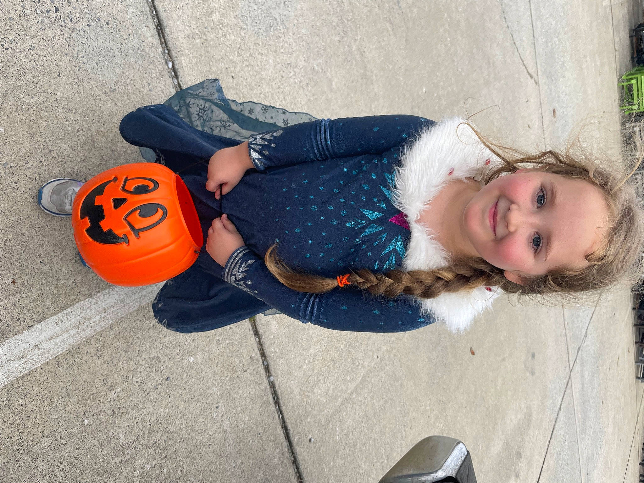 Harlie joined the competition — help win amazing prizes! asphalt, calabaza, child, concrete, denim, electric_blue, face, fun, gourd, grass, joy, leisure, person, pumpkin, road_surface, sidewalk, sitting, smile, street, toddler