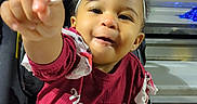 Symiah F joined the competition — help win amazing prizes! bleachers, bow, child, clothing, cute, face, hand, happy, headband, holding, infant, joy, lollipop, outdoor, person, playful, portrait, smile, toddler, young_child