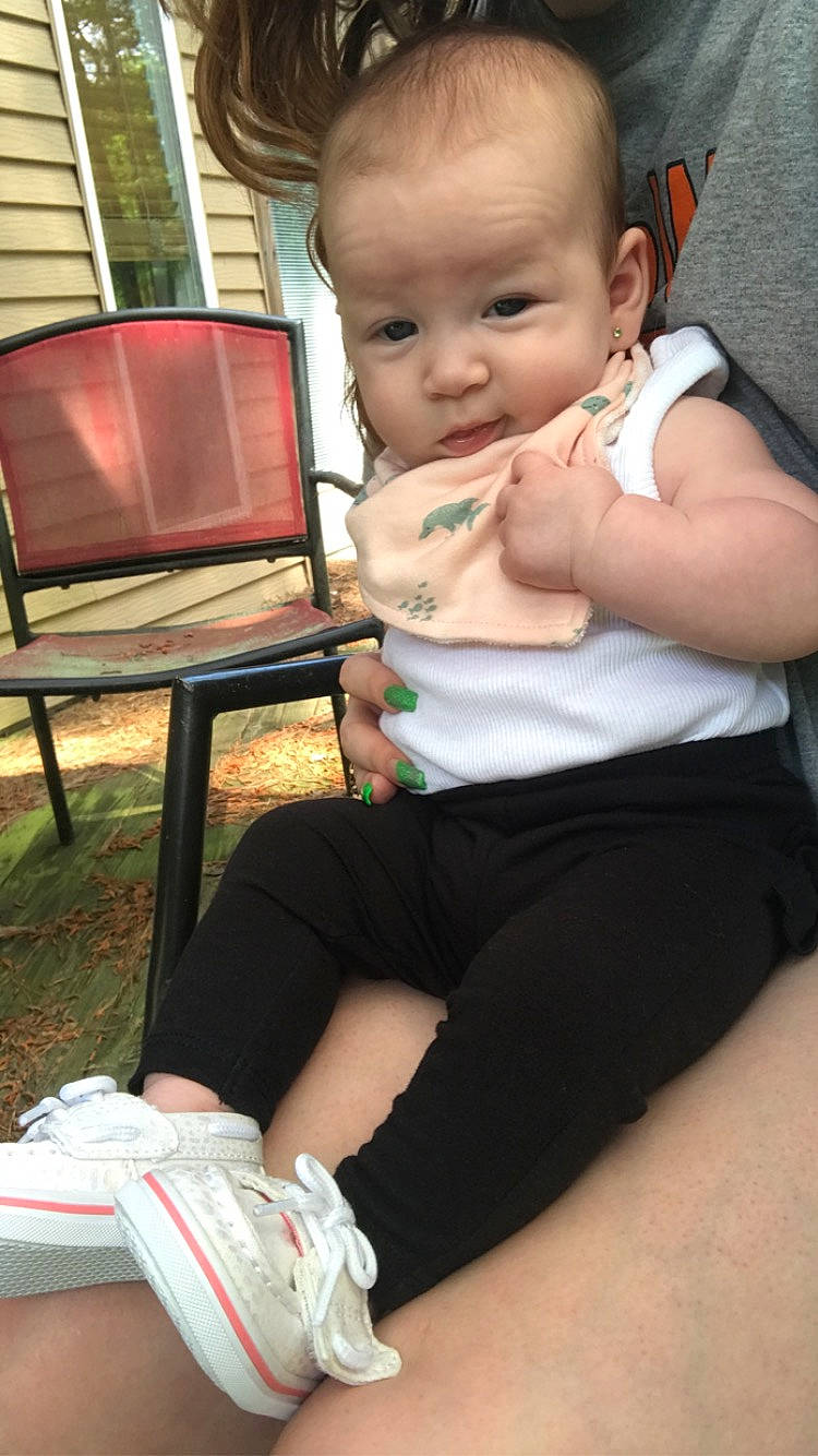 Adaline joined the competition — help win amazing prizes! baby, baby_toddler_clothing, chair, comfort, finger, fun, grass, happy, human_leg, joint, knee, lap, leg, muscle, person, sitting, skin, summer, thigh, toddler