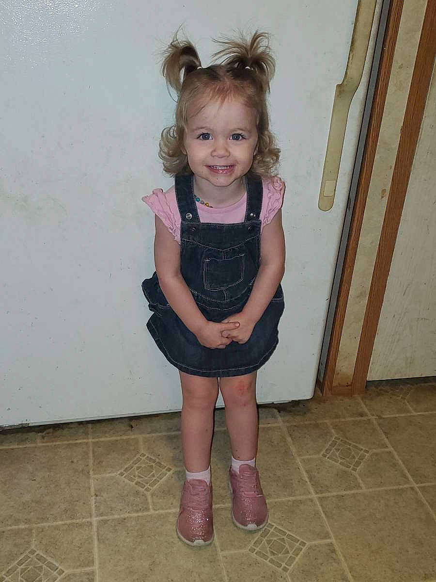 Ember joined the competition — help win amazing prizes! baby_toddler_clothing, embellishment, eye, face, flooring, footwear, hair, happy, head, human_body, human_leg, joy, knee, neck, outerwear, person, shoulder, sleeve, smile, thigh