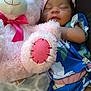 Billie joined the competition — help win amazing prizes! baby, sleeping, teddy_bear, plush_toy, blanket, pink, blue_clothing, infant, cuddling, soft_toy, cute, child, resting, indoor, cozy, headwear, sock, comfort, peaceful, person