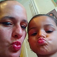 Peyton joined the competition — help win amazing prizes! child, adult, selfie, puckered_lips, duck_face, closeup, two_people, indoor, wall, portrait, family, playful, lips, eyes, hair, tank_top, earring, skin, ceiling, casual