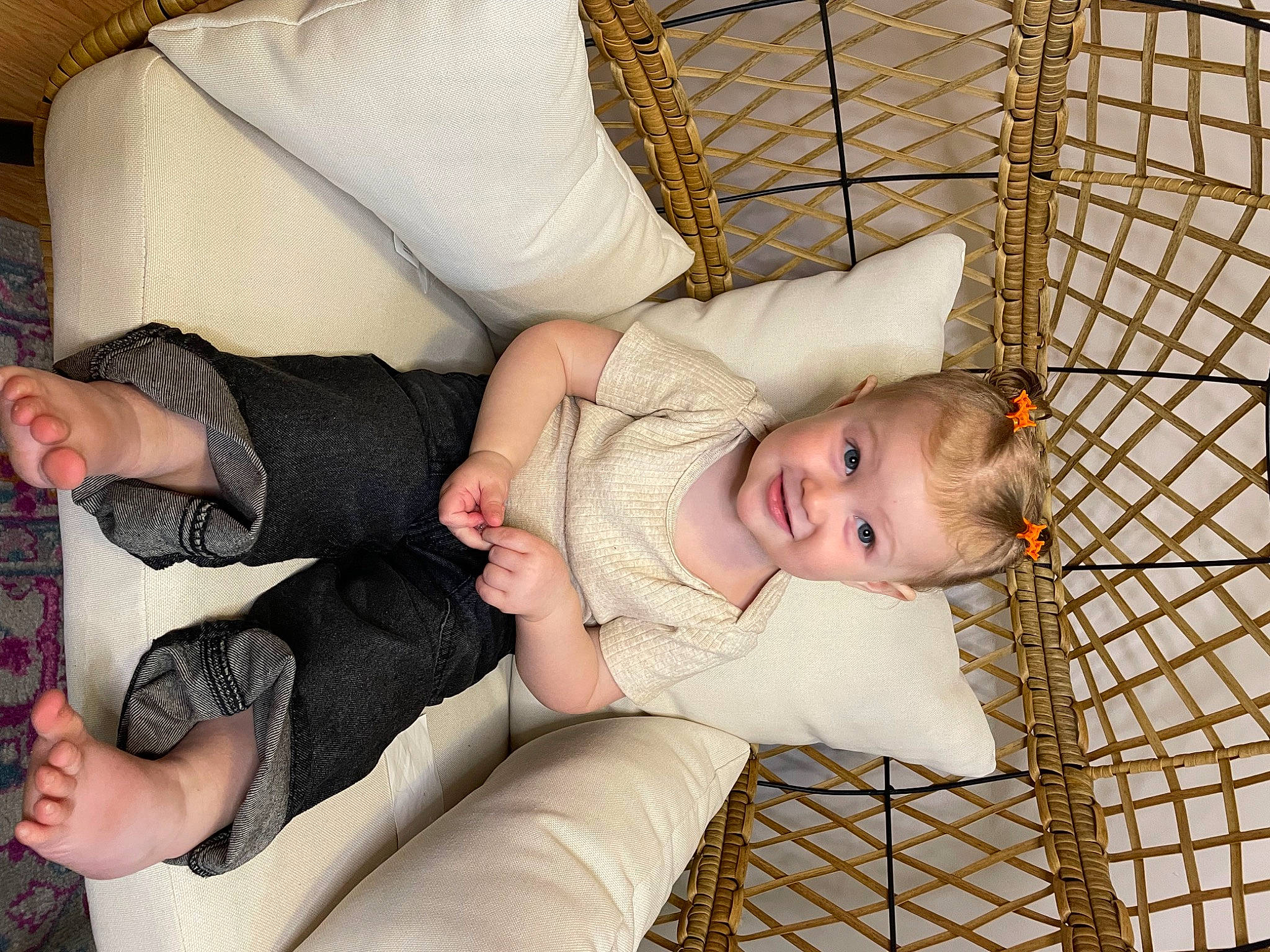 Millie is registered to the contest to win money with this photo: baby, baby_products, child, comfort, couch, facial_expression, foot, fun, human_leg, joy, knee, lap, linens, mesh, nap, person, room, sitting, sock, textile